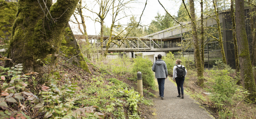 Students on the connecting pathway. Many people use the forested pathway behind our campus as a shortcut. The path begins at the back doo...