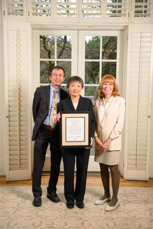 Ying Chen PhD '95, Distinguished Graduate standing with Jie Lian PhD '20 and Dean Jennifer Johnson