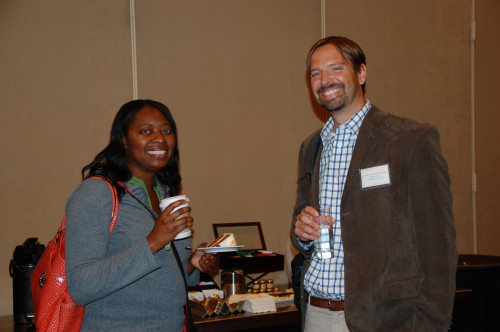 Conference faculty member Carlos Guillermo Salinas talks with a Conference attendee. - Photo by Susan Bexton