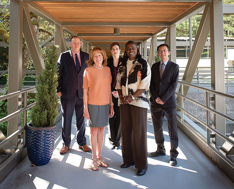 Members of the law school alumni board Brad Krupicka '10, Elli Tillotson '16, and Jie Lian '20 join Dean Johnson in welcoming President R...