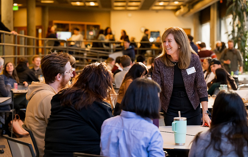 Dean Ouellette greets students.