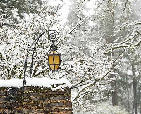 Exterior winter shot of campus with snow on the wall.