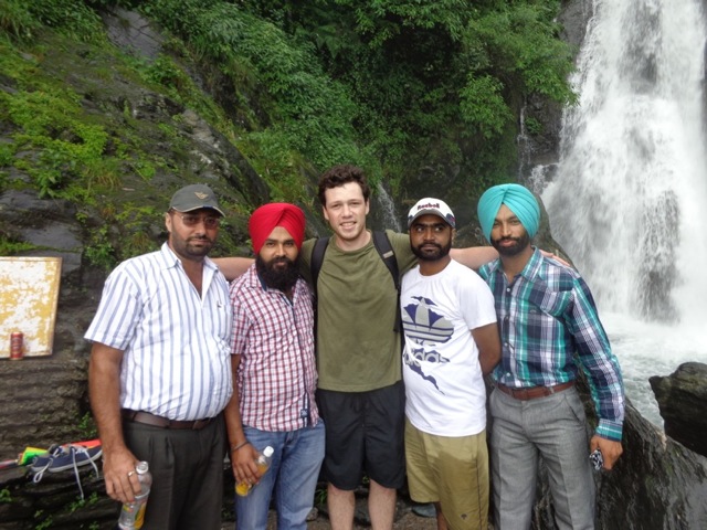 Victor Reuther (middle) with new friends at Bhagsu Falls, India
